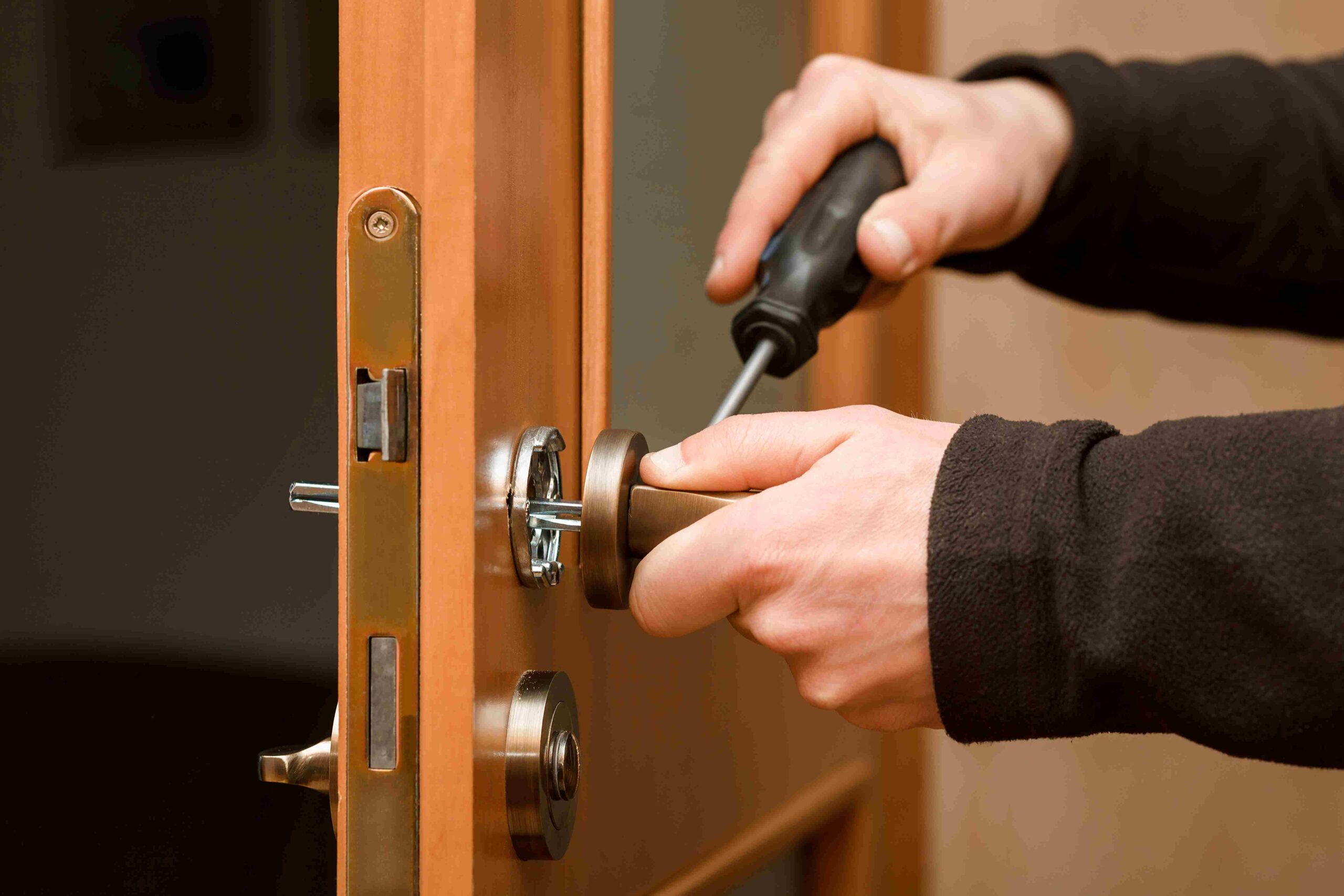 A locksmith fixing the door in west miami